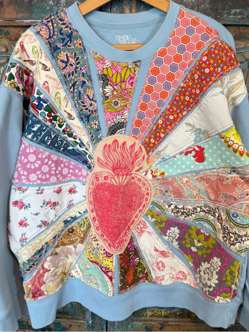 Maximalist handmade patchwork rayburst sacred heart sweater